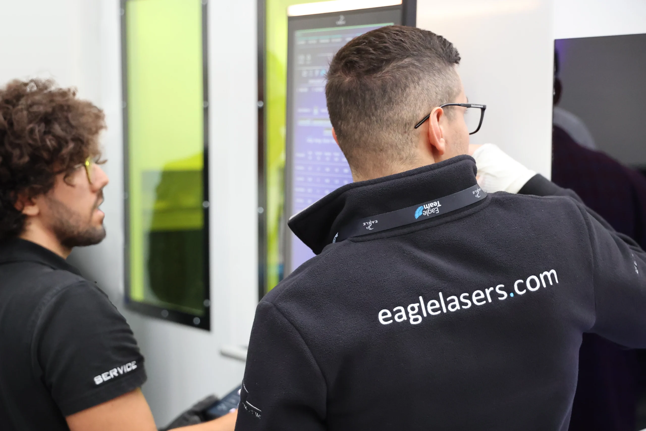 Eagle operators running fiber laser machine