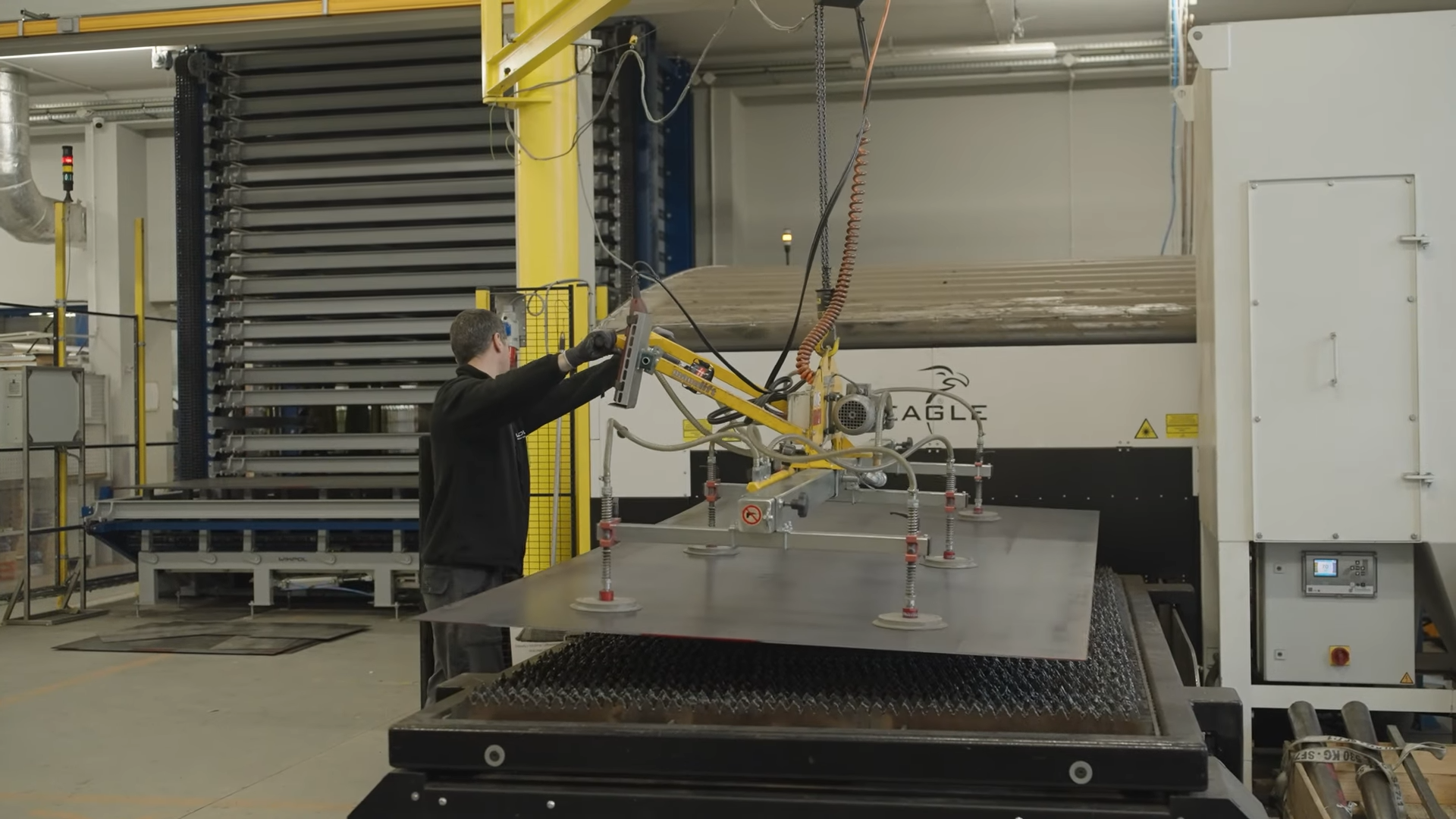 Photo of an operator replcing a metal sheet at Wikpol